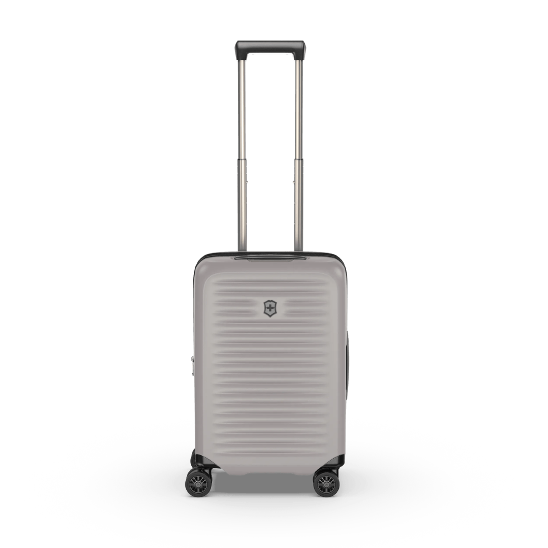 White VICTORINOX Airox Advanced hardside carry-on suitcase with expandable capacity and zippered anti-scratch pocket for devices.