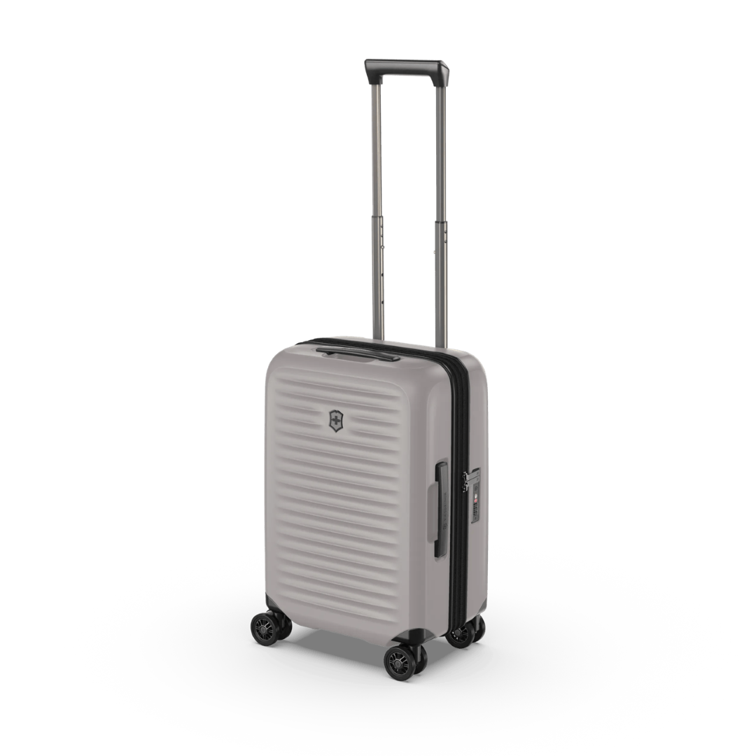 Stylish white hardside carry-on suitcase with expandable capacity and anti-scratch pocket for devices, ideal for any trip.