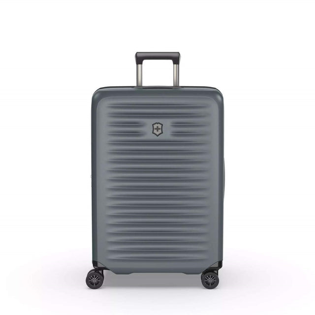 Sleek green VICTORINOX Airox Advanced Medium Hardside Case with compression straps and expandable capacity for effortless travel.