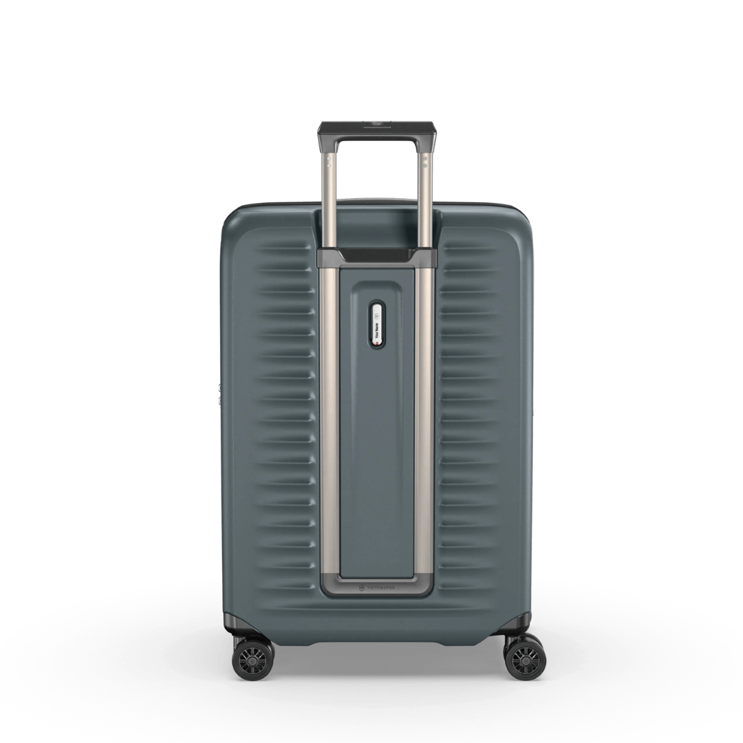 Sleek green polycarbonate hardside suitcase with expandable capacity, compression straps, and spinner wheels for easy travel.