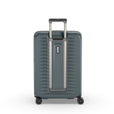 Sleek green polycarbonate hardside suitcase with expandable capacity, compression straps, and spinner wheels for easy travel.