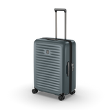 Lightweight polycarbonate hardside suitcase in Storm, featuring compression straps and 4-cm expansion for flexible travel.