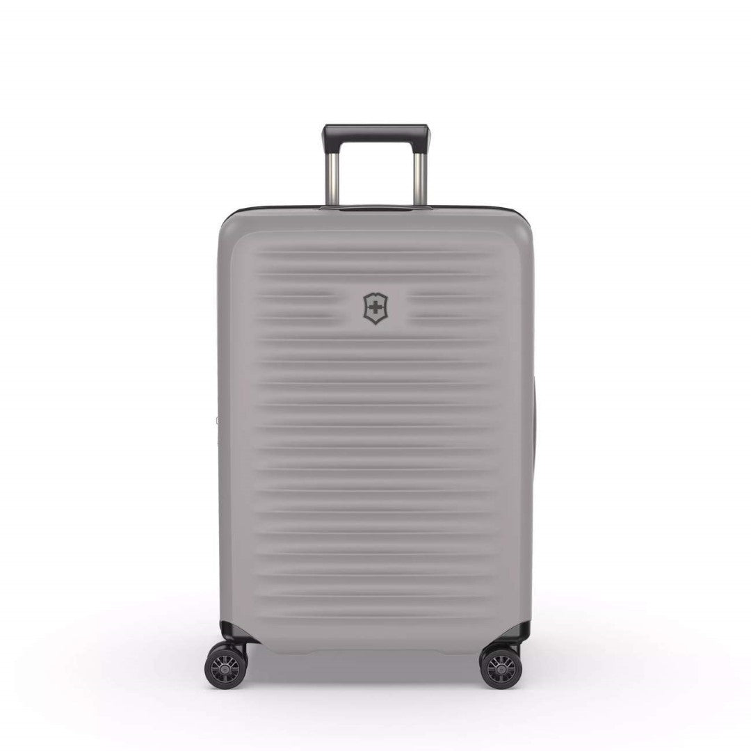 Sleek white VICTORINOX Airox Advanced Medium Hardside Case with expandable capacity and smooth spinner wheels for effortless travel.