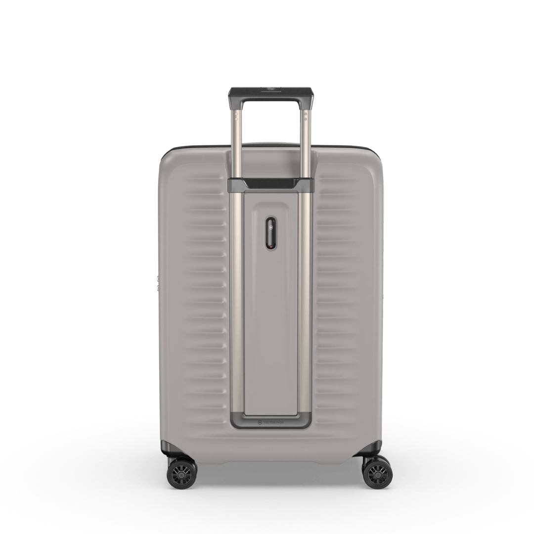 White VICTORINOX Airox Advanced Medium Hardside Case with expansion system, dual-tube handle, and 4-wheel spinners.