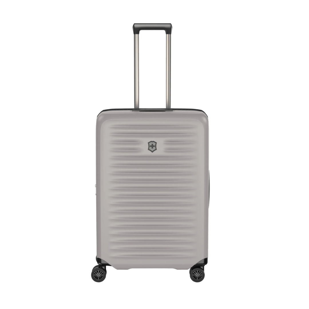 Sleek white VICTORINOX Airox Advanced Medium hardside case, featuring compression straps and expandable capacity for versatile travel.