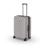 Sleek white VICTORINOX Airox Advanced Medium hardside case with expandable capacity and smooth 4-wheel mobility.