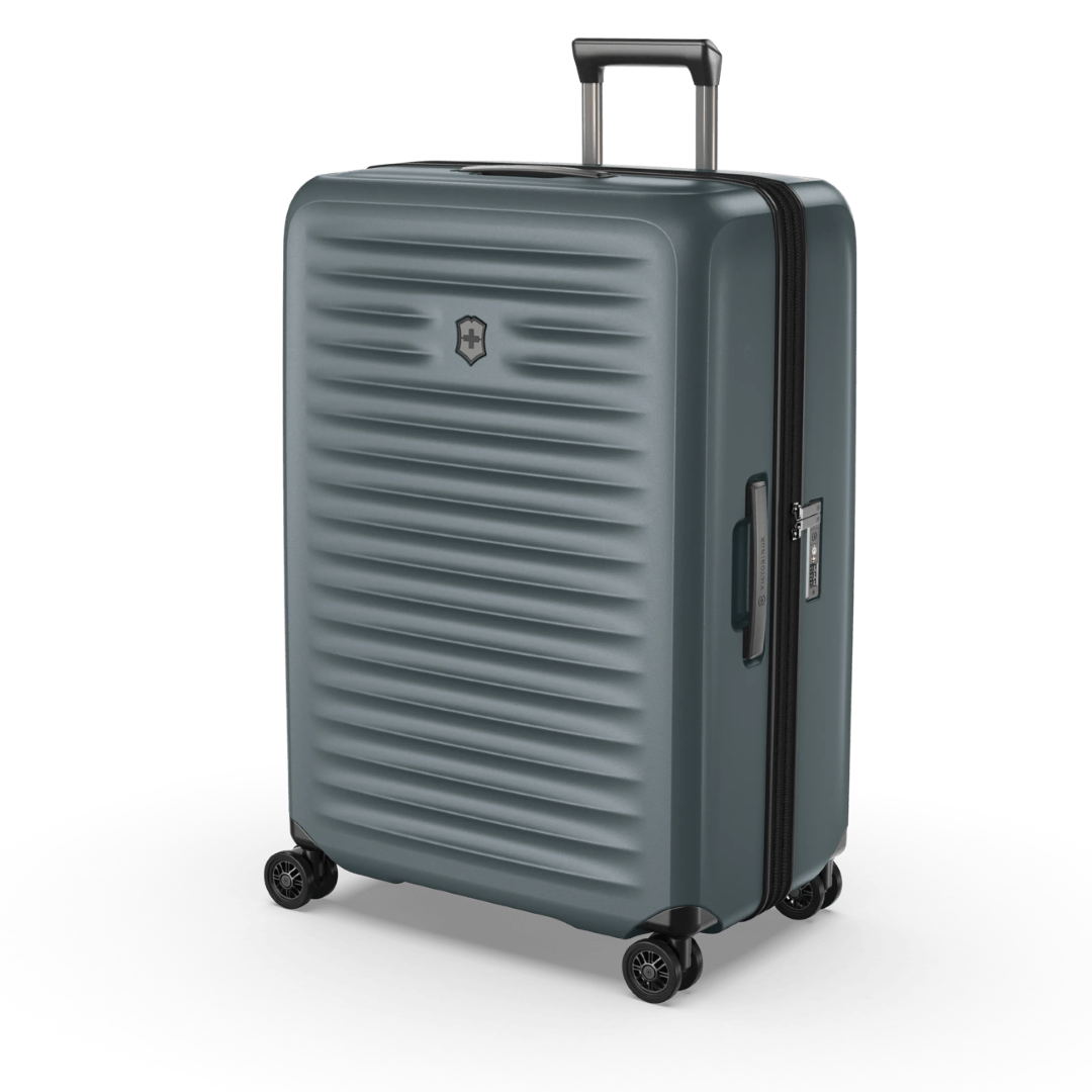 Green VICTORINOX Airox Advanced Large Hardside Case, lightweight with expandable capacity and dual-caster wheels for effortless travel.