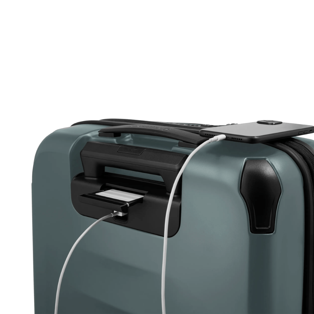 Durable green hardside carry-on suitcase with expandable capacity, 8 wheels, and quick-access front organization compartment.