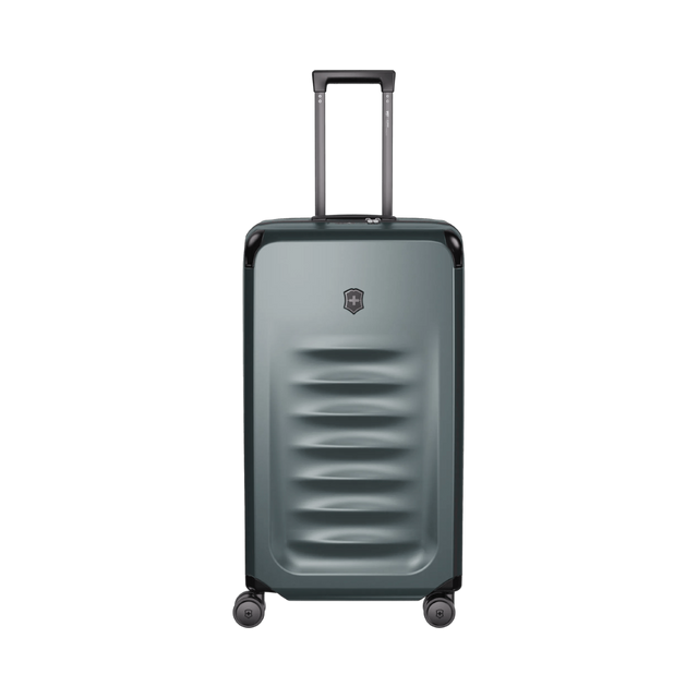 Storm-colored VICTORINOX Spectra 3.0 Large Hardside Trunk featuring durable SORPLAS™, 99L capacity, and smooth 8-wheel mobility.