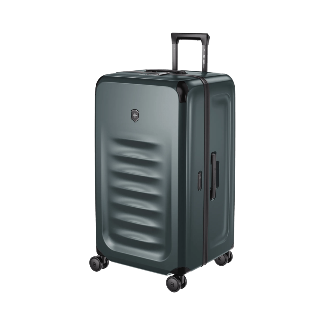 Hardside trunk in Storm color, 99L capacity with SORPLAS™ material, 8 wheels, and integrated packing cubes for organized travel.