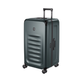 Hardside trunk in Storm color, 99L capacity with SORPLAS™ material, 8 wheels, and integrated packing cubes for organized travel.