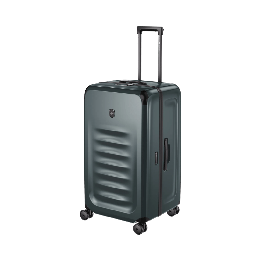 Large VICTORINOX Spectra 3.0 hardside trunk in Storm, featuring durable SORPLAS™ material, 99L capacity, and smooth 8-wheel system.