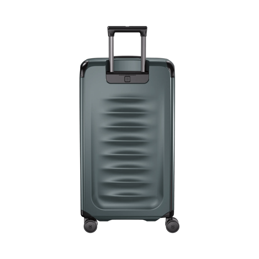 Hardside trunk in Storm color featuring 99L capacity, dual-tube handle, and 8-wheel spinner system for easy travel.