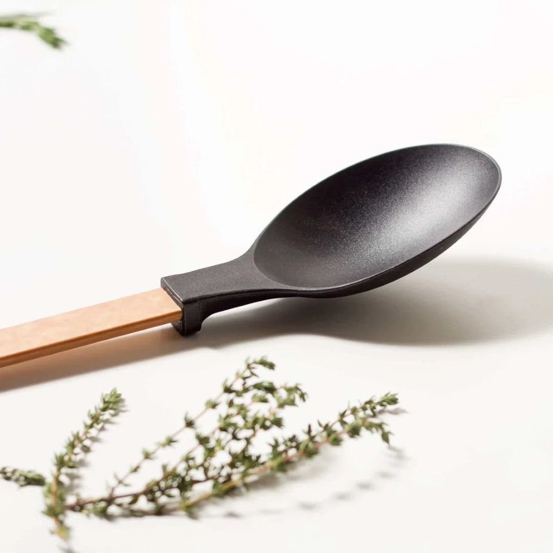 Large Epicurean spoon with heat-resistant nylon head and composite handle, featuring built-in kickstand for kitchen convenience.