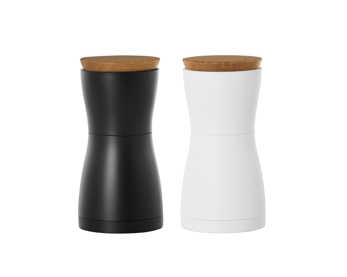 Salt and pepper mill set in black and white, featuring adjustable ceramic grinder for fine to coarse seasoning, 13.3cm tall.