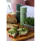 Elegant green salt and pepper mill set made of varnished beech wood with adjustable ceramic grinder, 15cm tall.