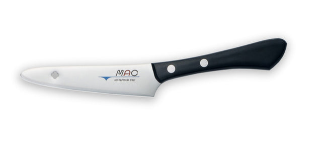 Sharp 4" MAC Original CP paring knife with elevated handle, ideal for peeling and cutting on a board.