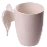 Ceramic mug with a white angel wings handle, holding 380ml, perfect for tea or coffee, adds charm to any kitchen.