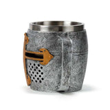 Decorative tankard featuring a medieval knight helmet design in silver and gold, made of resin and stainless steel.