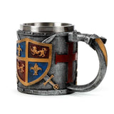 Decorative gold and silver coat of arms tankard, 17cm tall, made of resin and stainless steel for home decor display.