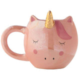 Whimsical unicorn-shaped ceramic mug with vibrant rainbow design, perfect for enjoying hot beverages, 560ml capacity.