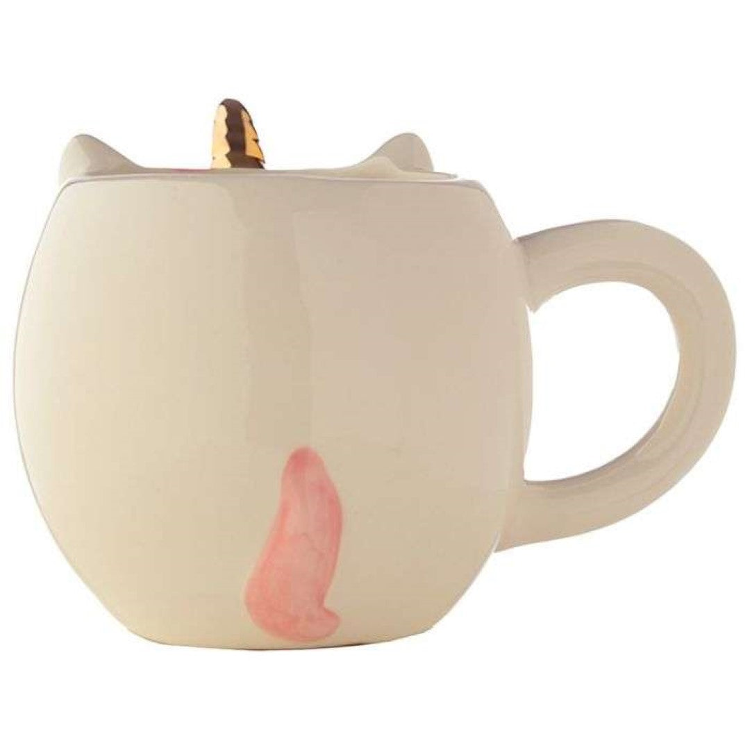 Whimsical unicorn-shaped ceramic mug with rainbow design, perfect for hot beverages and adding magic to your kitchen.