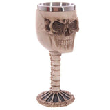 Decorative 18cm skull and spine goblet made of resin and stainless steel, perfect for gothic decor and eye-catching displays.