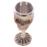 Decorative 18cm skull goblet with spine design, crafted from resin and stainless steel for gothic home decor.