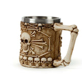 Decorative skull and bone tankard with bone handle, featuring intricate design and stainless steel for gothic decor.