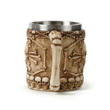 Decorative tankard with skull and bone design, featuring a bone handle, perfect for gothic decor lovers.