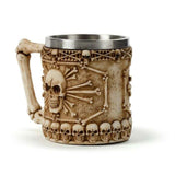 Decorative tankard featuring a skull and bone design, with a bone handle, perfect for gothic decor enthusiasts.