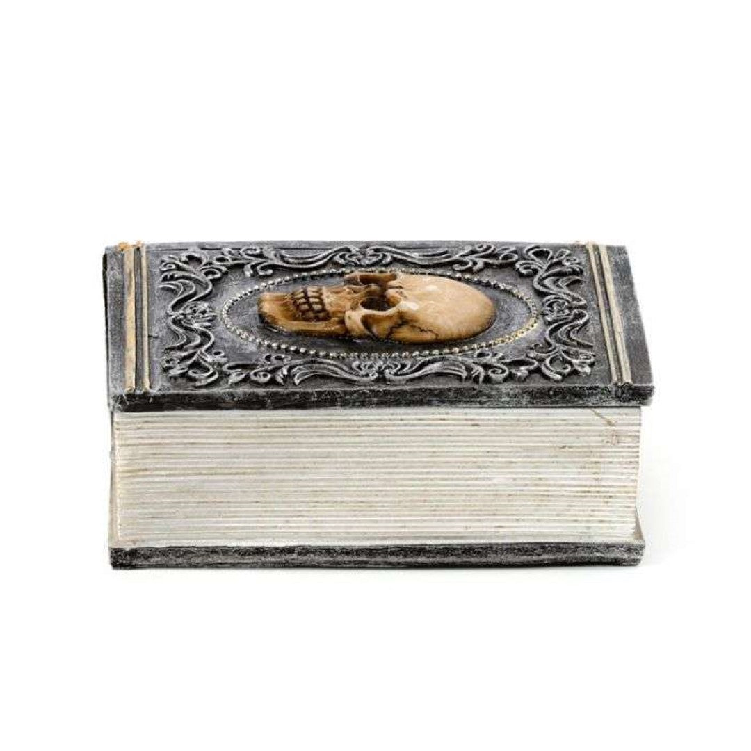 Book-shaped trinket box with skull embellishments, perfect for storing jewelry and showcasing decorative style.