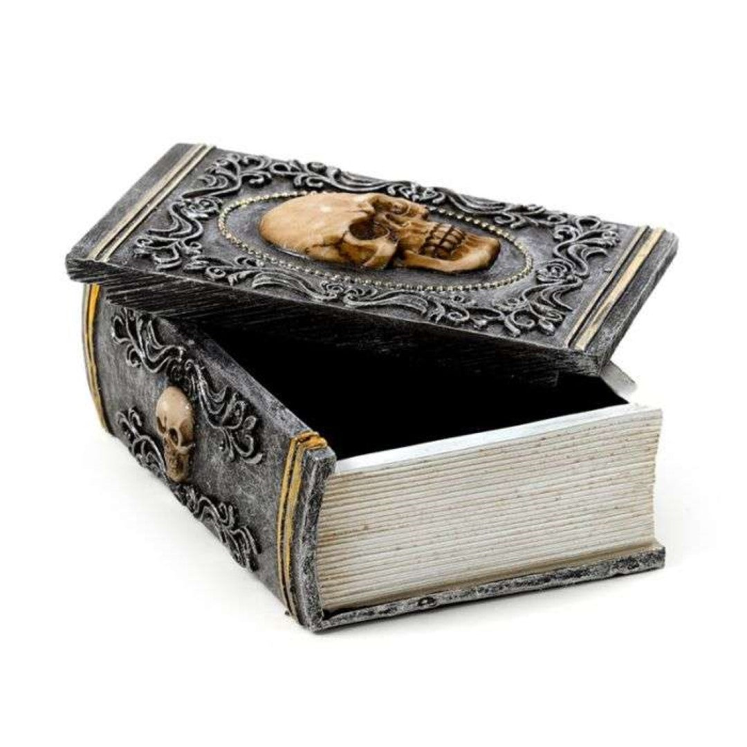 Skull embellished decorative trinket box shaped like a book, perfect for storing jewelry and collectibles.