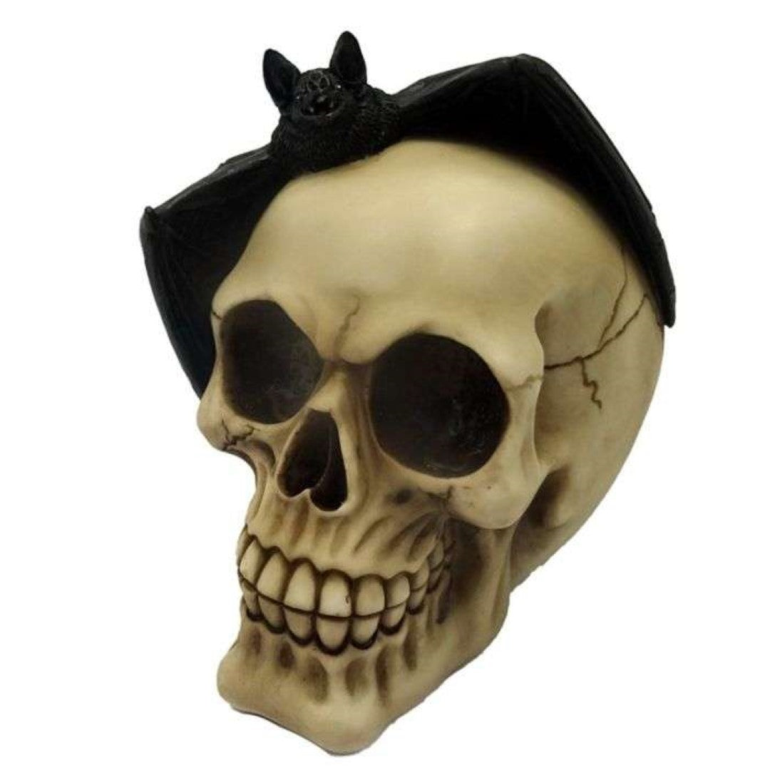 Gruesome 15cm skull ornament with detailed features and a bat perched on top, perfect for Halloween décor.