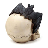 Gruesome skull head ornament with a bat, intricately detailed, perfect for Halloween or gothic decor, measuring 15cm tall.