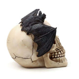 Ornate 15cm skull ornament with bat, featuring chilling details perfect for Halloween or gothic decor.