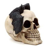 Gruesome 15cm skull ornament with a bat, perfect for Halloween or gothic decor enthusiasts.