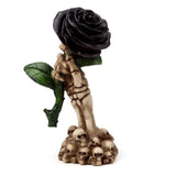 Ornate skeleton hand grasping a black rose, 17cm tall; ideal for gothic decor and Halloween themes.