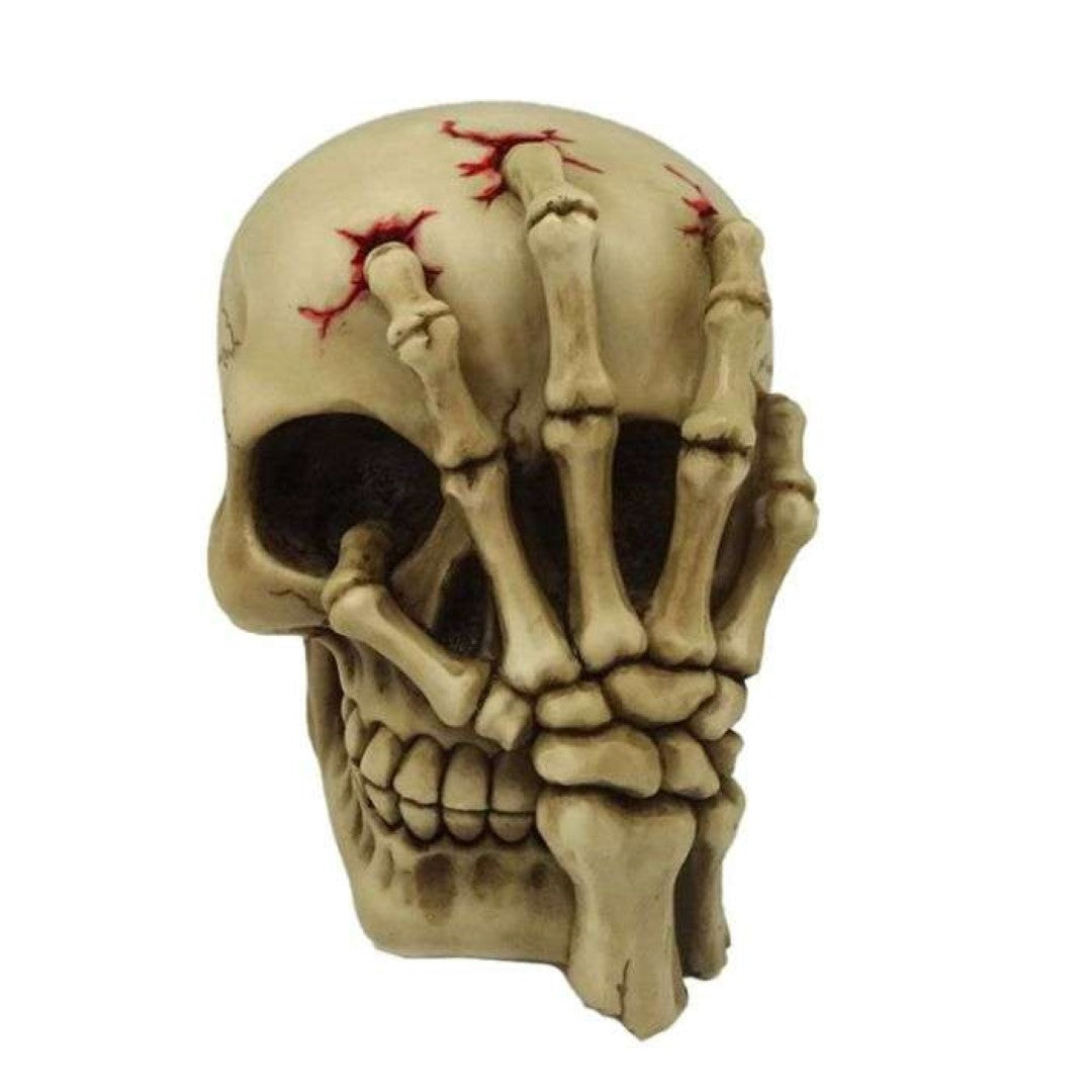 Gruesome skull head ornament with skeleton claw hand, 16cm tall, perfect for gothic decor and Halloween themes.