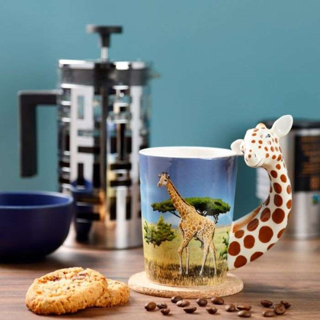 Ceramic mug featuring a giraffe decal and shaped handle, 400ml capacity, food safe but not microwave or dishwasher safe.