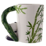 Ceramic mug featuring a panda with bamboo decal, shaped handle, perfect for adding charm to your drinkware collection.