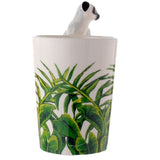 Ceramic mug featuring a lemur design with a jungle decal and playful shaped handle, perfect for coffee or tea lovers.