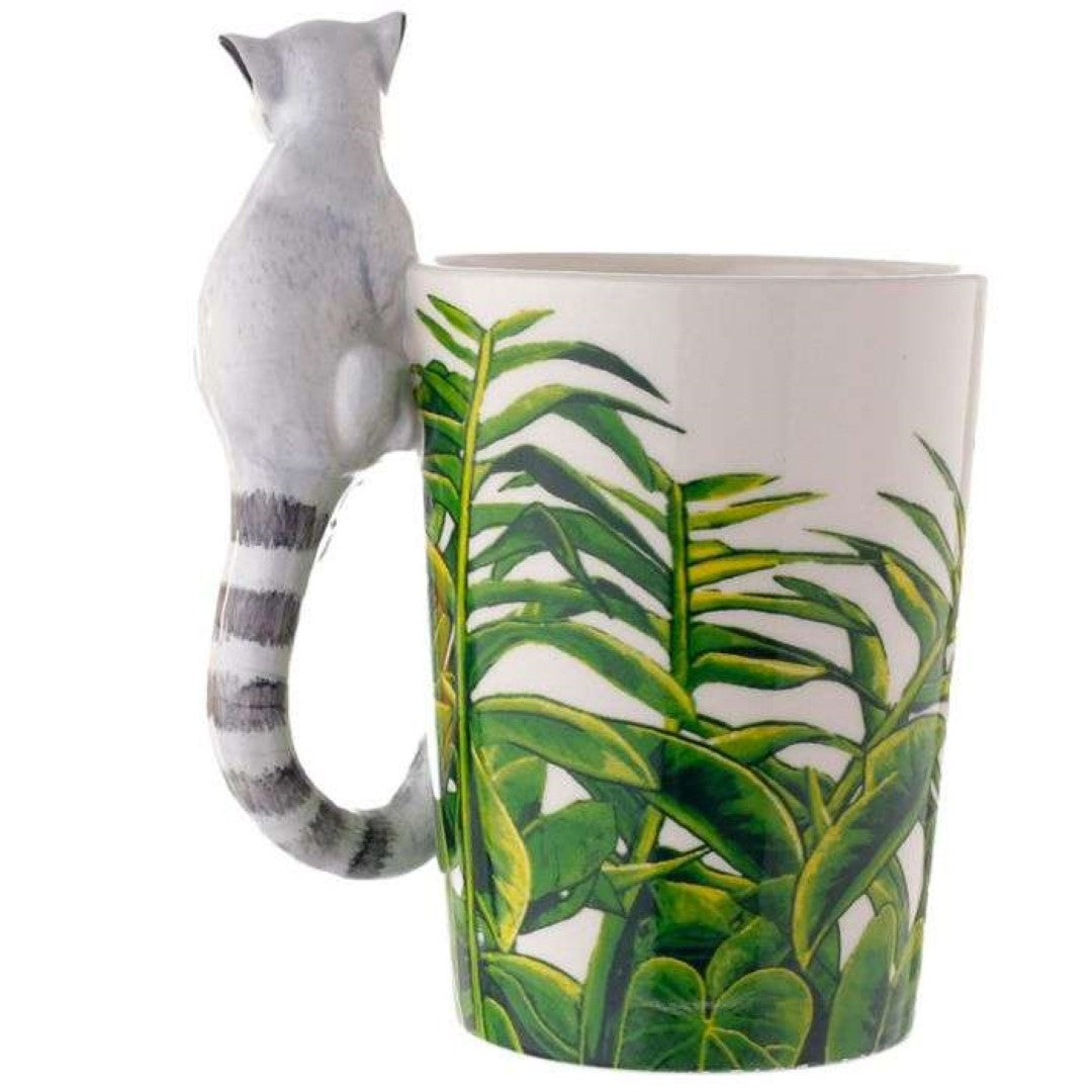 Ceramic mug featuring a lemur and jungle decal, with a playful shaped handle, perfect for tea or coffee lovers.