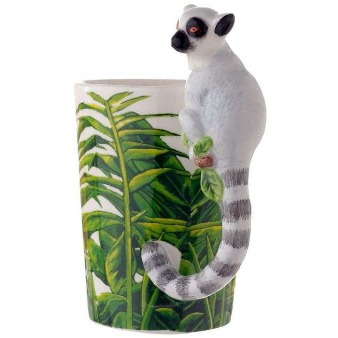 Ceramic mug featuring a lemur design, vibrant jungle decal, and playful shaped handle, ideal for nature lovers.