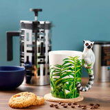 Ceramic mug showcasing a playful lemur with jungle decal and shaped handle, perfect for nature lovers, 400ml capacity.