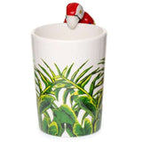 Vibrant ceramic mug featuring a parrot design, jungle decal, and playful shaped handle, ideal for hot beverages.