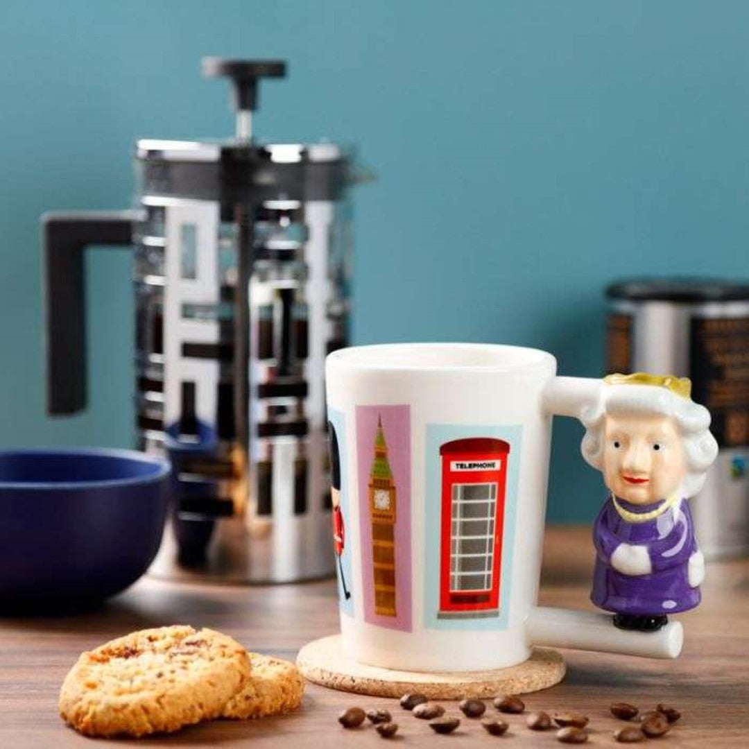 Ceramic mug with a unique Queen-shaped handle, 400ml capacity, showcasing London’s charm and elegance for tea or coffee.