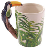 Ceramic mug with vibrant Toucan design and jungle decal handle, perfect for coffee and tea lovers.