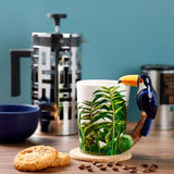 Ceramic mug with vibrant toucan design, jungle handle, 400ml capacity, ideal for coffee and tea lovers.