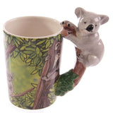 Ceramic mug with a whimsical koala-shaped handle, perfect for coffee or tea, holding 400ml.